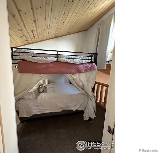 bedroom featuring carpet, lofted ceiling, and wood ceiling