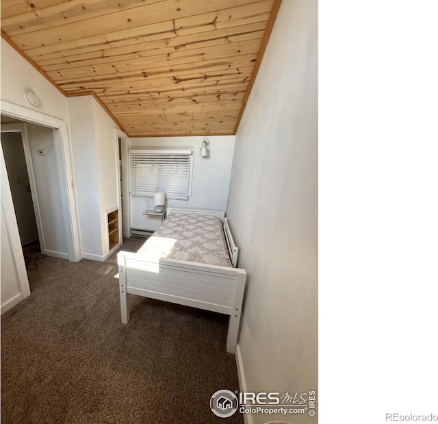 carpeted bedroom featuring baseboards, wood ceiling, ornamental molding, vaulted ceiling, and baseboard heating