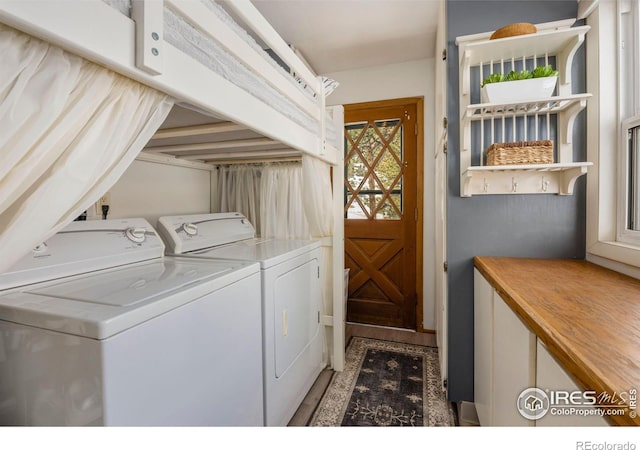 laundry area with washing machine and dryer and laundry area