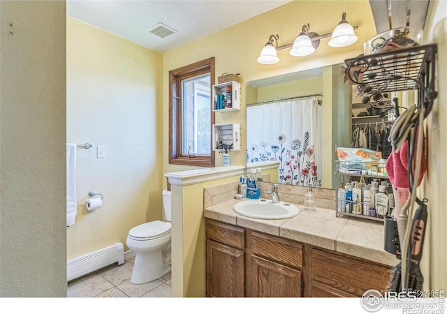 bathroom with vanity, visible vents, tile patterned flooring, toilet, and baseboard heating