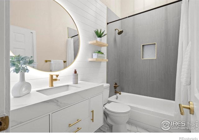 bathroom featuring toilet, marble finish floor, vanity, and shower / bath combination with curtain