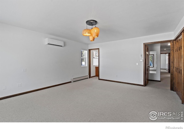 871 E Ln, Estes Park, CO 80517 - carpeted spare room with a baseboard radiator, a wall mounted air conditioner, and baseboards