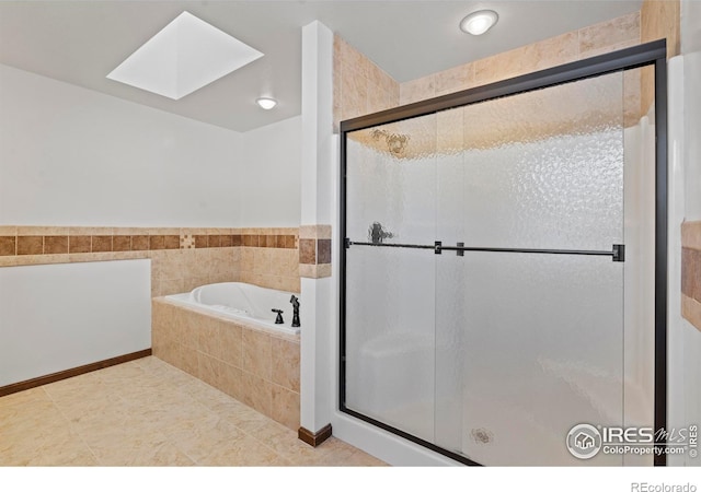 871 E Ln, Estes Park, CO 80517 - bathroom with a bath, a stall shower, and a skylight