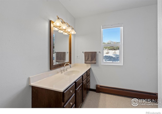 871 E Ln, Estes Park, CO 80517 - bathroom with a baseboard heating unit, vanity, and baseboards