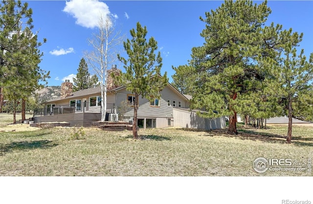 871 E Ln, Estes Park, CO 80517 - view of front of property featuring a chimney and a deck