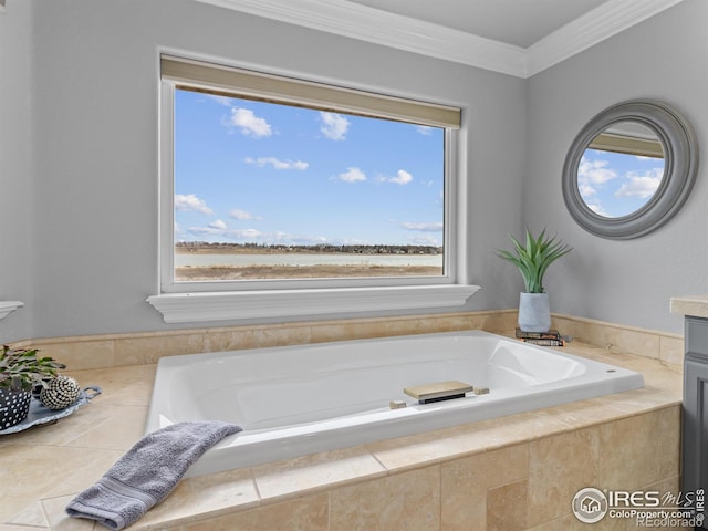 bathroom with tile patterned floors, vanity, crown molding, and a garden tub