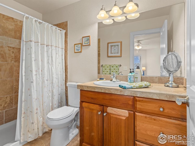 bathroom with vanity, ceiling fan, tile patterned floors, toilet, and shower / tub combo with curtain