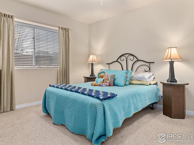 bedroom featuring baseboards