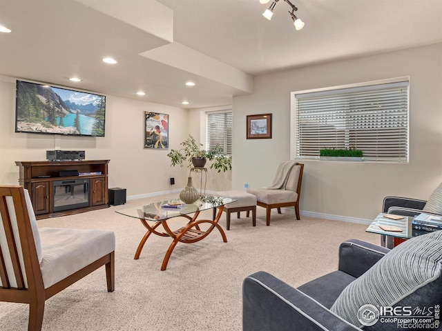 carpeted living room with recessed lighting and baseboards