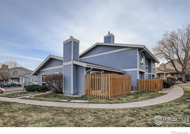 view of home's exterior featuring central AC and fence