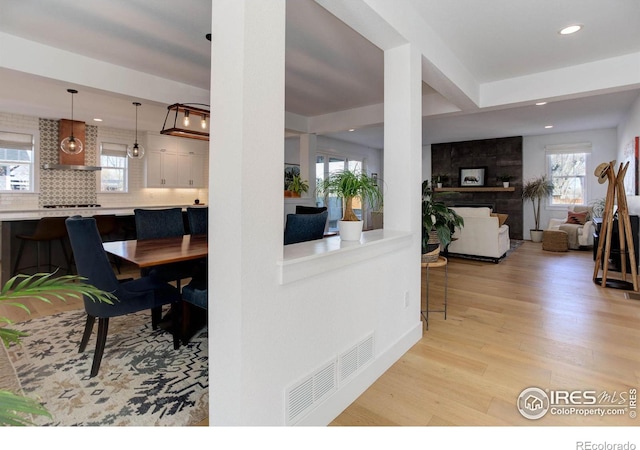 dining room featuring visible vents, recessed lighting, and light wood-type flooring