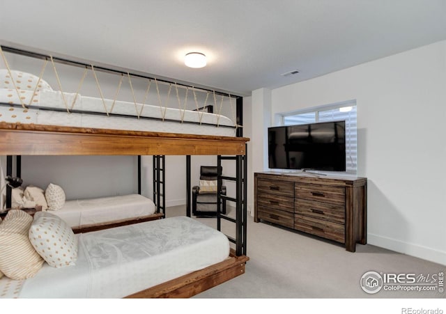 bedroom featuring carpet flooring, baseboards, and visible vents