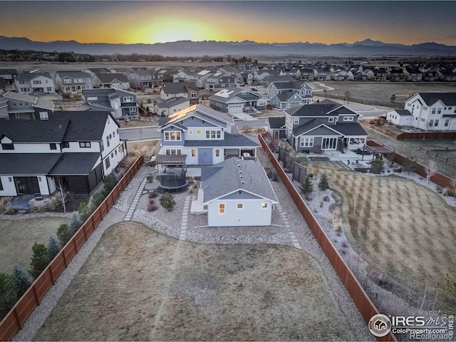 birds eye view of property featuring a mountain view and a residential view