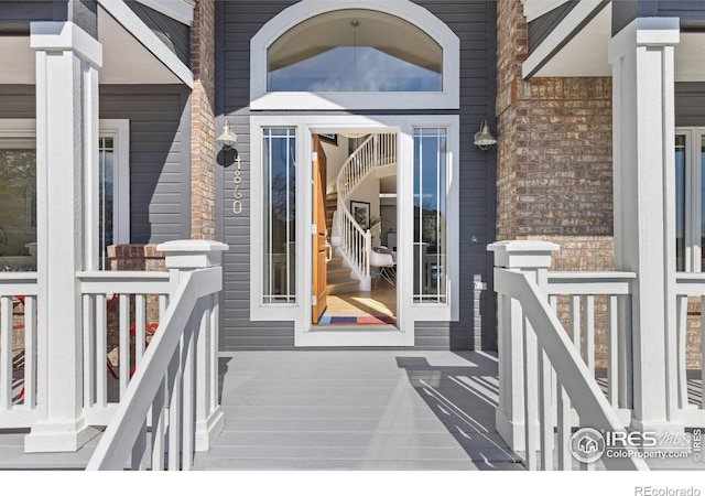 entrance to property with brick siding