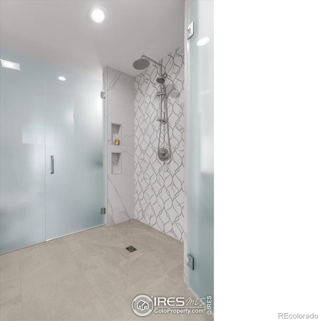 full bath featuring tile patterned flooring, a shower stall, and recessed lighting