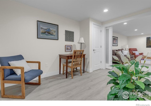 sitting room featuring recessed lighting, baseboards, and wood finished floors