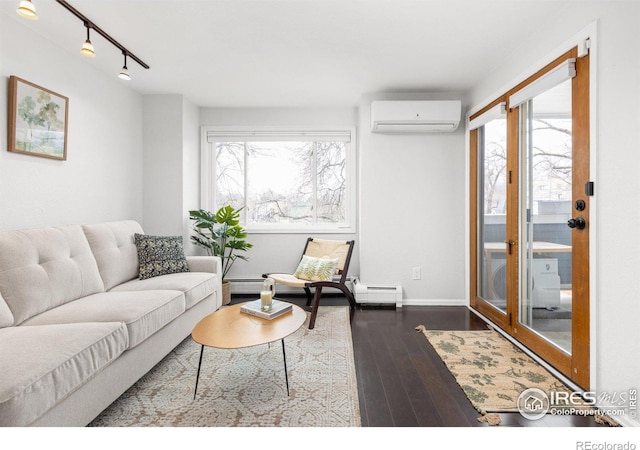 living area featuring baseboards, plenty of natural light, dark wood-type flooring, and a wall mounted AC