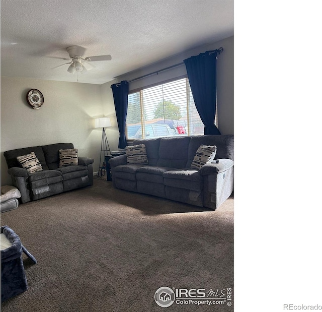 carpeted living area featuring ceiling fan and a textured ceiling