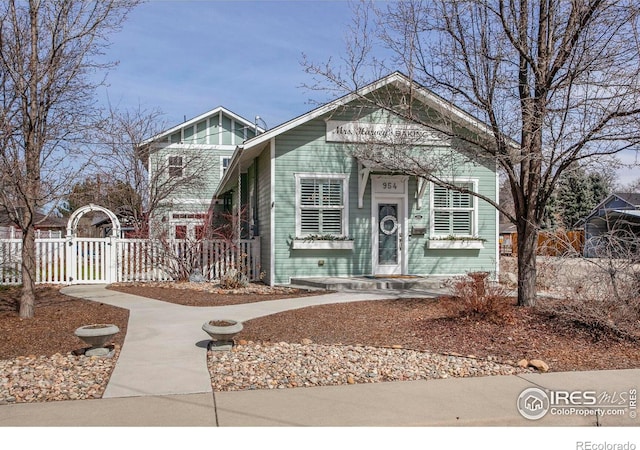 view of front of home with a gate and fence