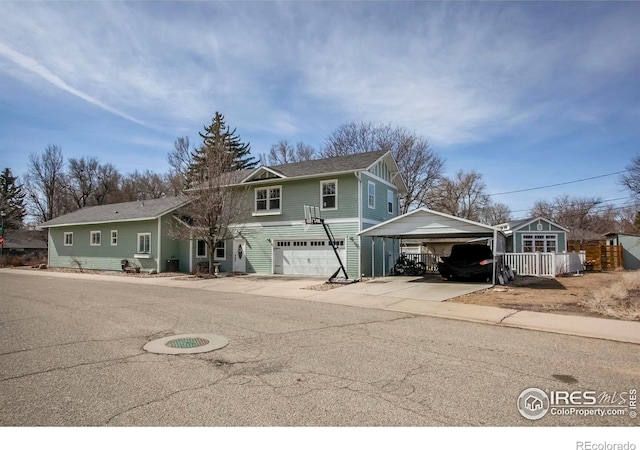 view of front of house featuring a detached carport and concrete driveway