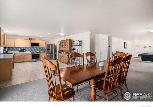 3937 Kenwood Cir, Johnstown, CO 80534 - dining room with billiards, light tile patterned floors, light colored carpet, and recessed lighting