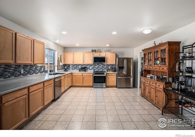 3937 Kenwood Cir, Johnstown, CO 80534 - kitchen featuring recessed lighting, backsplash, appliances with stainless steel finishes, and a sink