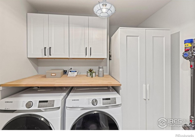 laundry room with cabinet space and separate washer and dryer