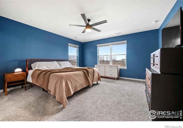 bedroom featuring baseboards, carpet, ceiling fan, and visible vents