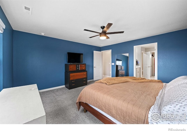 bedroom with visible vents, baseboards, ceiling fan, carpet flooring, and ensuite bath