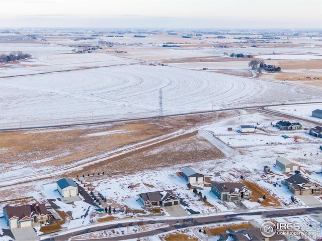 snowy aerial view featuring a residential view