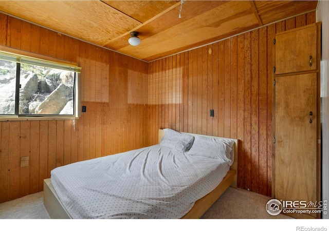 224 Loveland Heights Ln, Drake, CO 80515 - carpeted bedroom with wooden ceiling and wooden walls