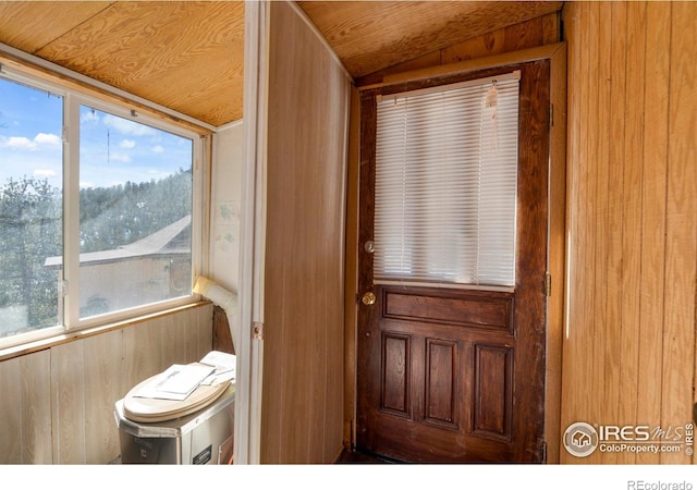 224 Loveland Heights Ln, Drake, CO 80515 - doorway featuring wood walls and lofted ceiling