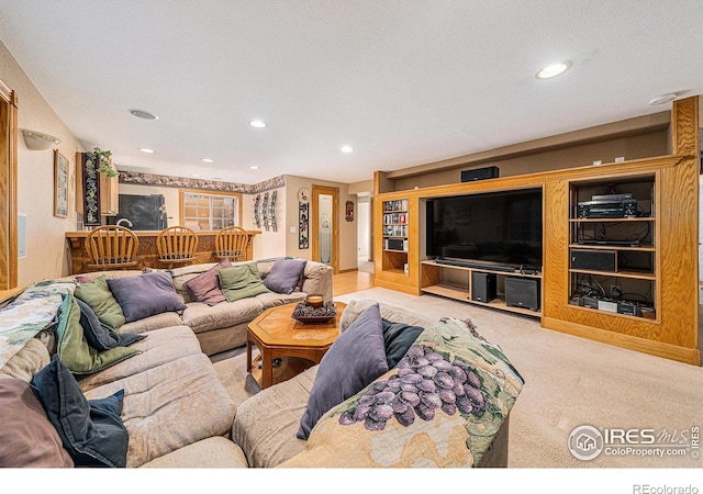 carpeted living room featuring recessed lighting