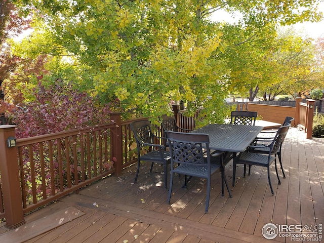 wooden deck featuring outdoor dining space