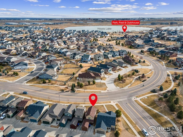 birds eye view of property with a residential view