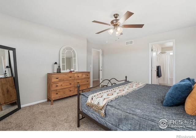 carpeted bedroom with visible vents, baseboards, and a ceiling fan