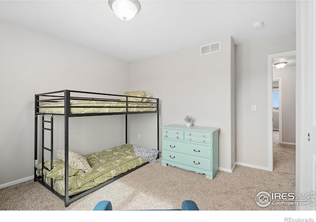 bedroom featuring visible vents, baseboards, and carpet floors