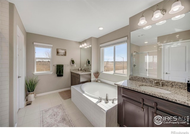 bathroom featuring a sink, plenty of natural light, a bath, and a shower stall