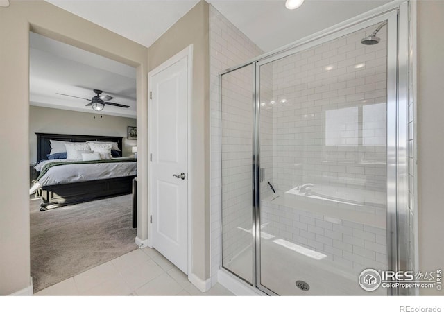 bathroom with a shower stall, tile patterned floors, and ensuite bathroom