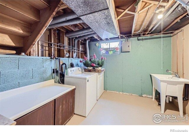 clothes washing area featuring washer and dryer and laundry area