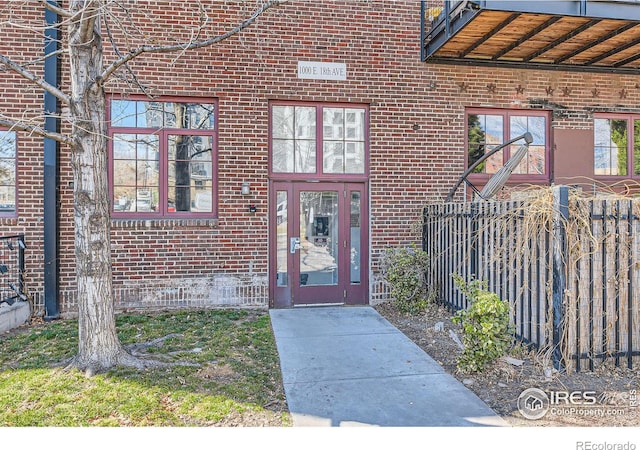 property entrance with brick siding