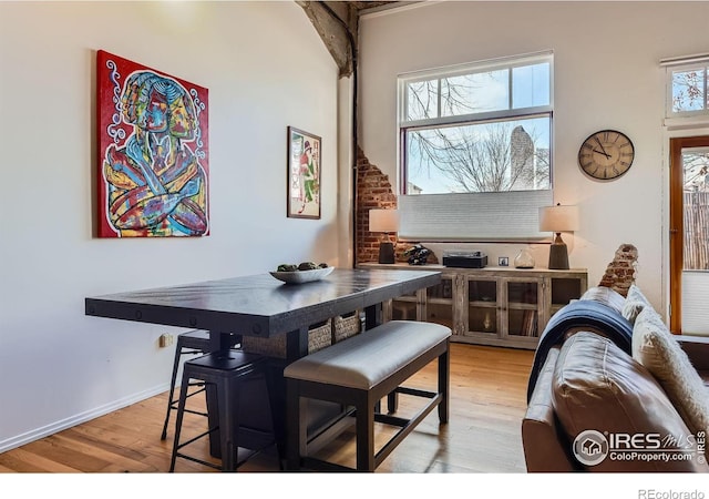 dining area featuring wood finished floors and baseboards