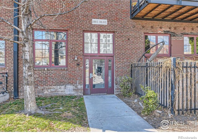 1000 E 18th Ave, Denver, CO 80218 - doorway to property featuring brick siding