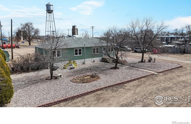 view of front of property with driveway and a chimney