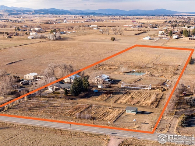 drone / aerial view with a rural view and a mountain view