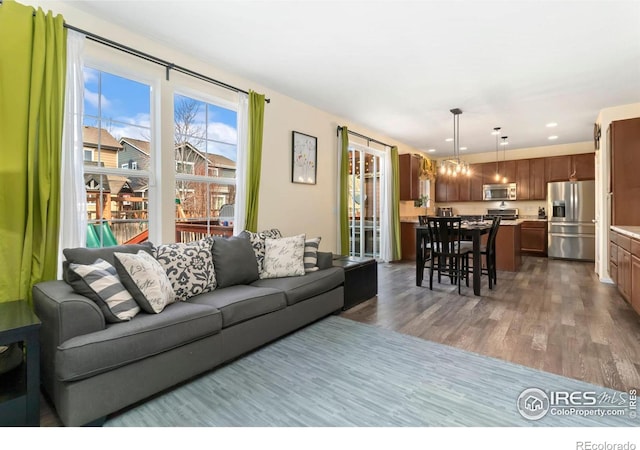 living room featuring recessed lighting and wood finished floors