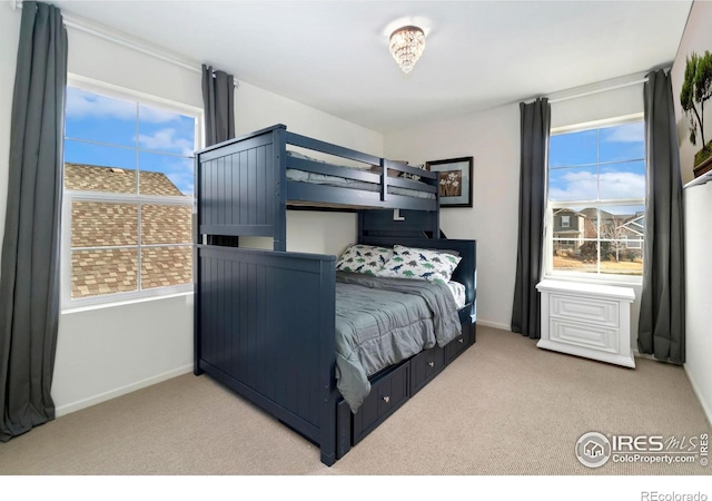 bedroom featuring baseboards and carpet flooring