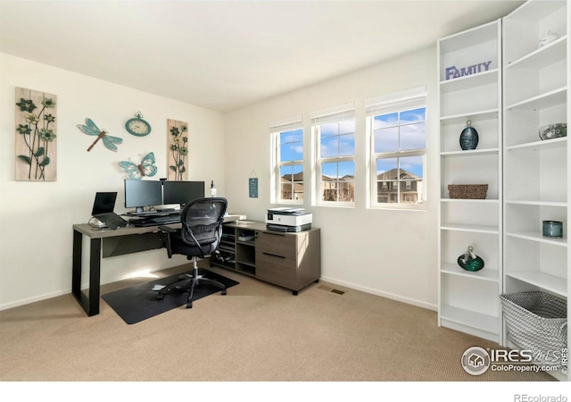 home office featuring visible vents, baseboards, and carpet