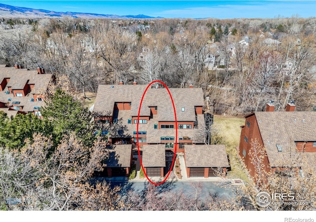 drone / aerial view featuring a mountain view