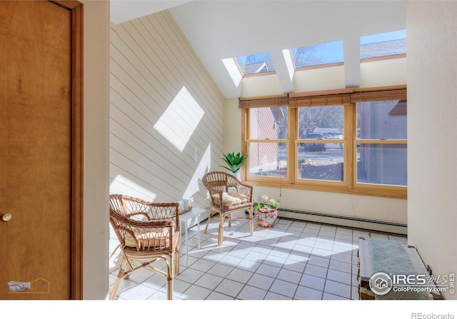 unfurnished sunroom featuring vaulted ceiling with skylight and a baseboard heating unit